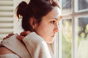 Depressed Woman Looking Out The Window